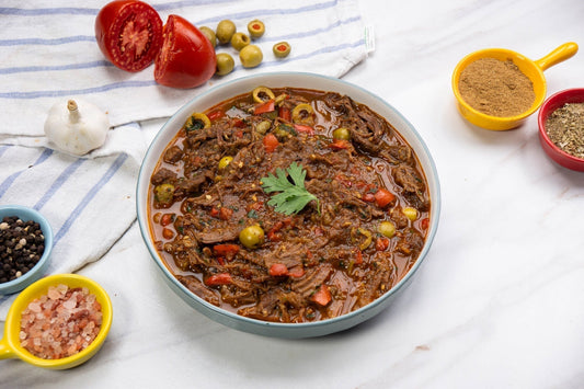 A pot of Cuban Ropa Vieja ( beef stew) with endometriosis friendly modifications