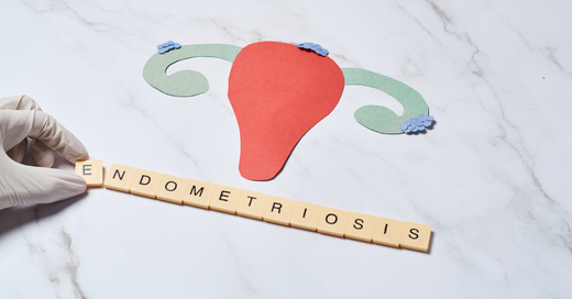 image of a uterus with wooden letters spellings out the word endometriosis